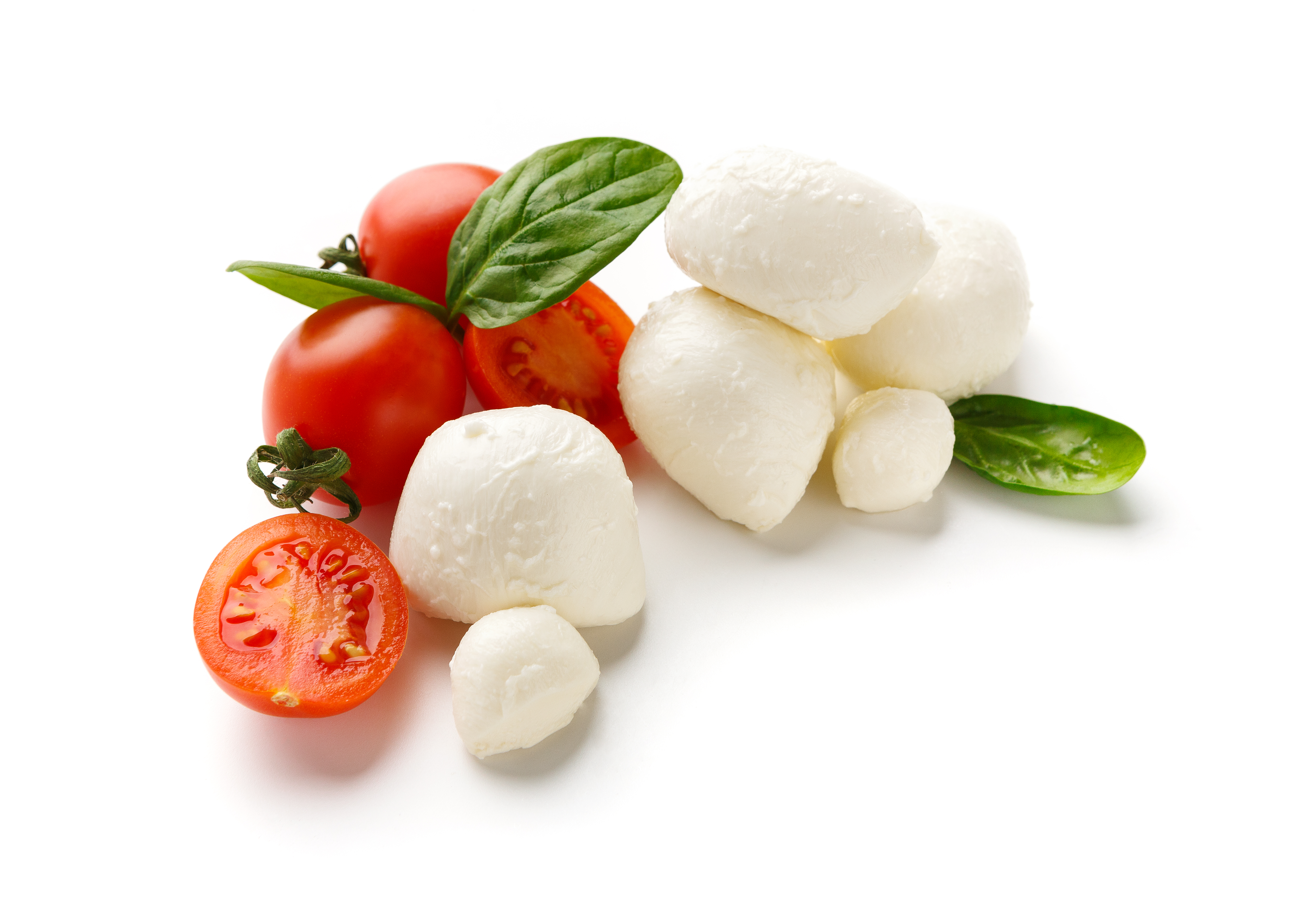Fresh mozzarella balls with cherry tomatoes and basil leaves.