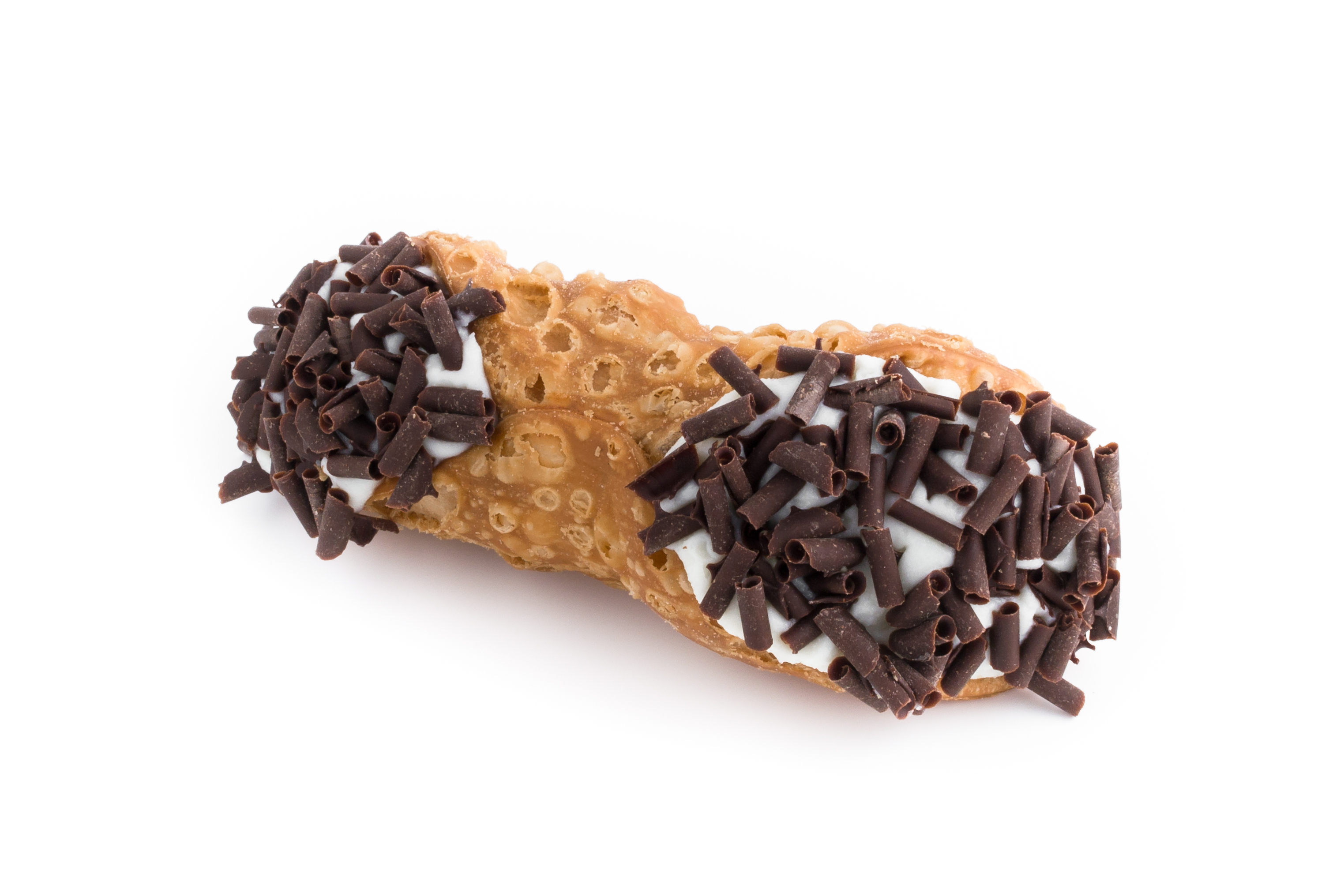 A cannoli dessert topped with chocolate sprinkles on both ends.