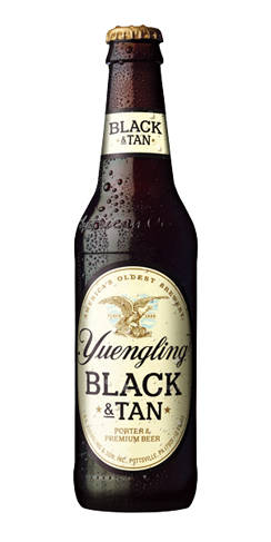 Bottle of Yuengling Black & Tan beer with condensation droplets.
